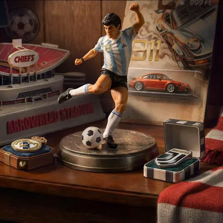 A detailed miniature display featuring a football player figurine kicking a soccer ball next to a toy sports car and custom game tokens at SlimKing Casino.